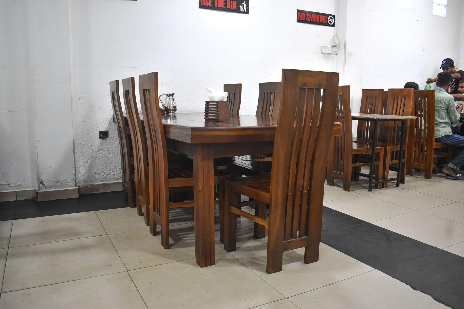 Kurunduwatta Dining Hall — Long teak tables ready for the lunch rush at Food Cabin Galle